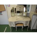 A French style cream and gilt dressing table with triple mirror and stool and a similar bedside