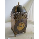 A brass lantern clock with double fusee movement