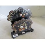 A Victorian papier mache correspondence rack inlaid mother of pearl