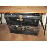 Two metal tin trunks