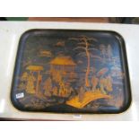 A black lacquer tray with chinoiserie scenes