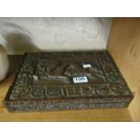 A carved chinese box with dragon and flower design