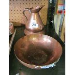 A Borrowdale hand beaten copper bowl and 19th Century copper measuring jug.