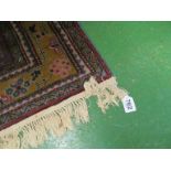 A Persian style rug blue ground and geometric pattern