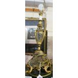 A gilt urn shaped table lamp