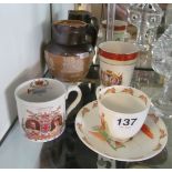 A Royal Doulton stoneware jug, Bunnykins cup and saucer and two commemorative mugs