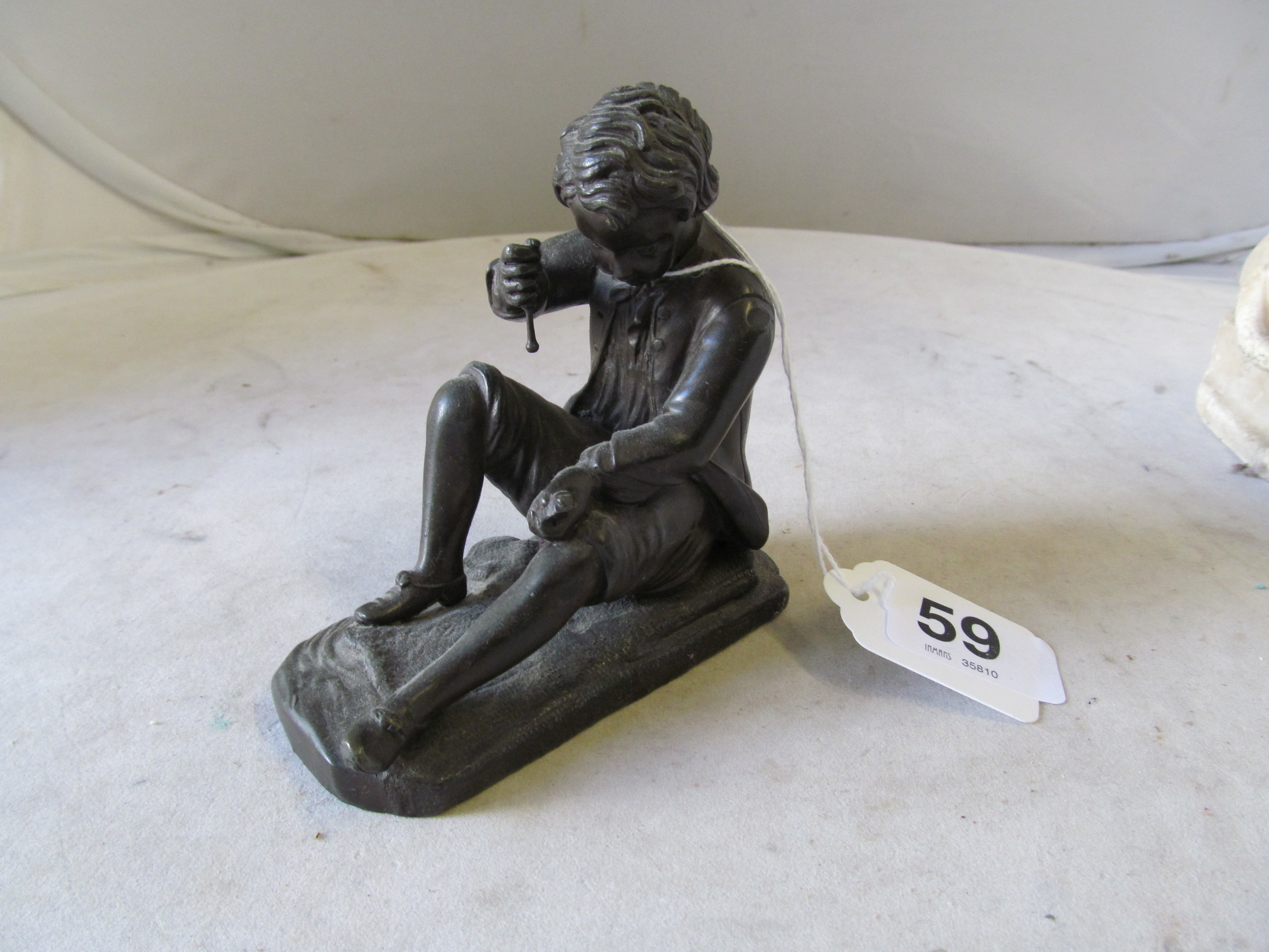 A 19th Century Spelter figure of a boy with fish. .