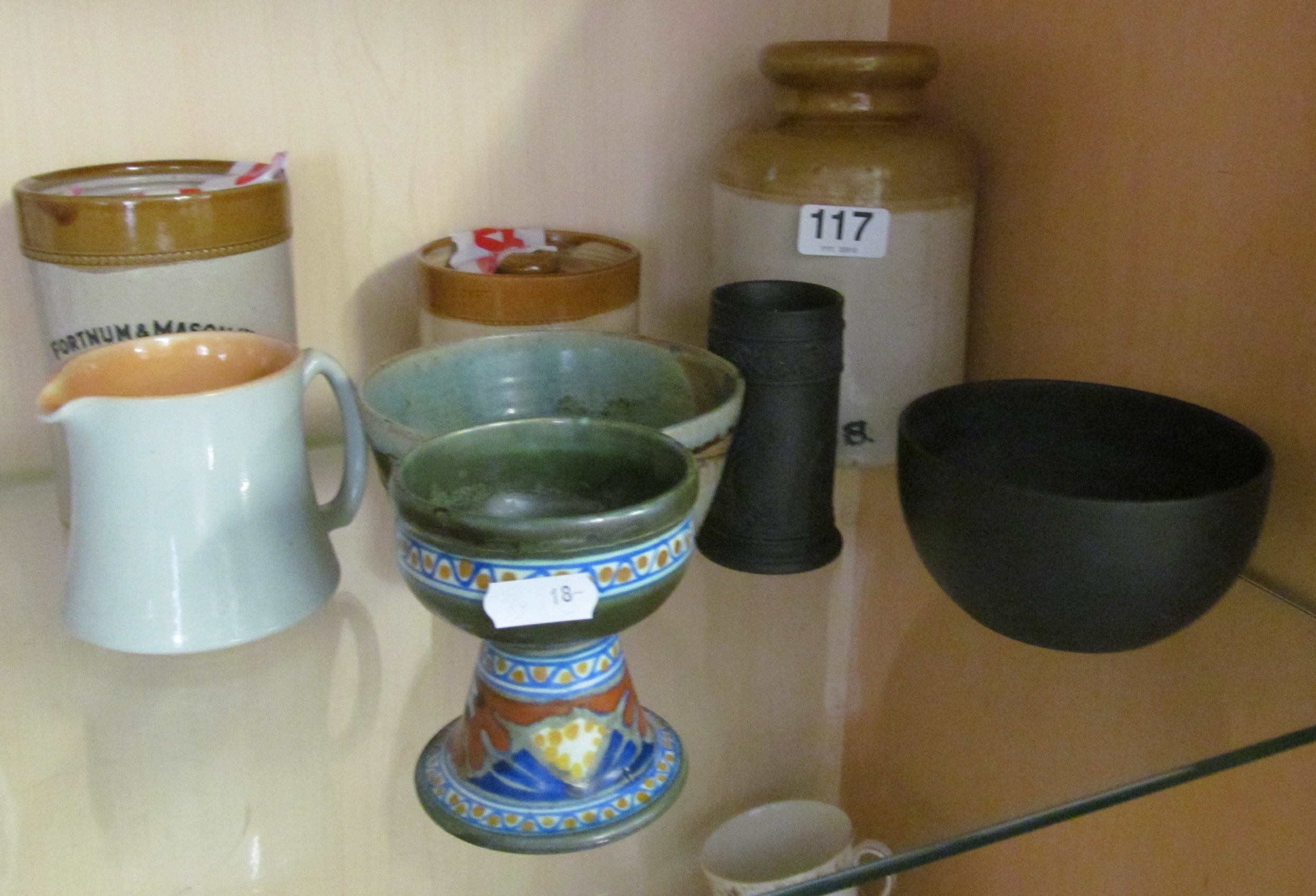 Three stoneware jars and a small group of other pottery
