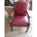 A chippendale style chair in red leatherette