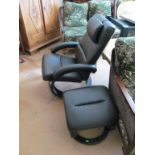 A swivel chair and footstool