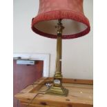 A brass corinthian column table lamp and another smaller