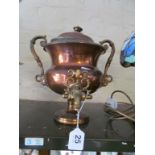 A copper samovar.