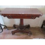 A 19th Century mahogany card table on turned column and platform base