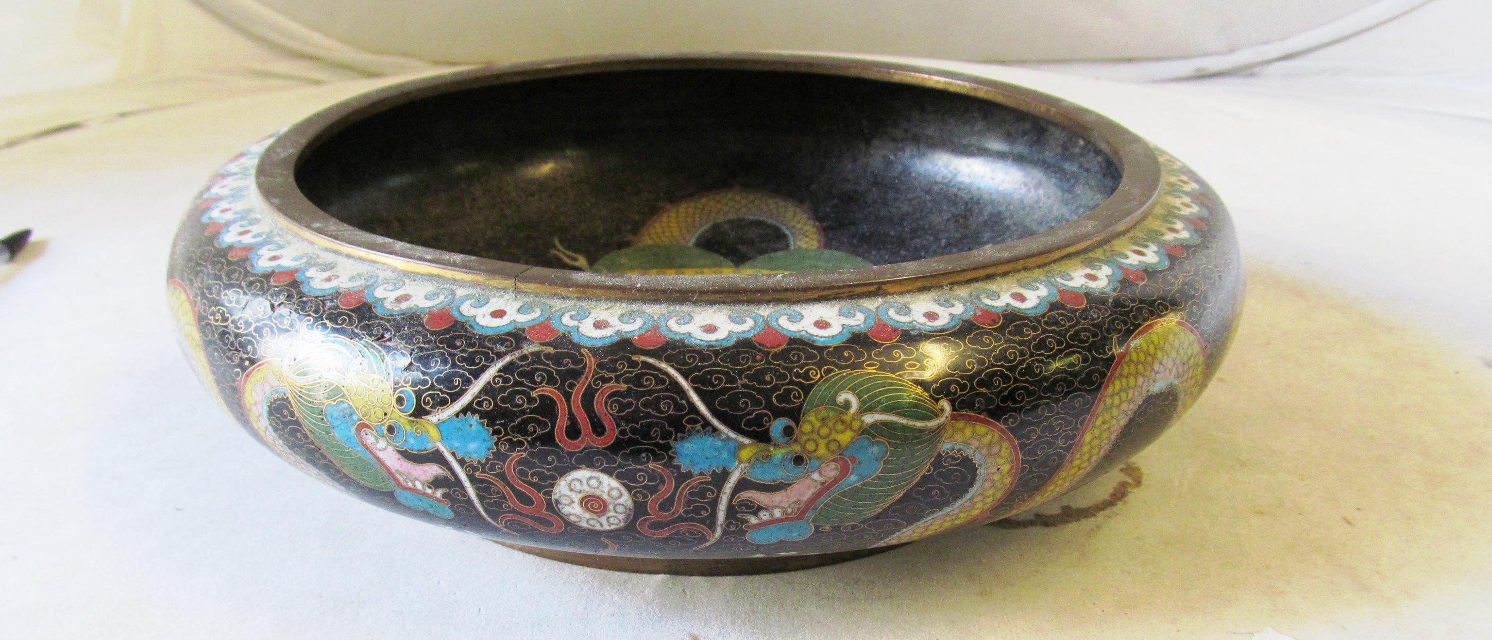 An early 20th Century cloisonné bowl dragon on a black background. - Image 2 of 3