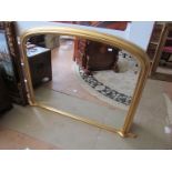 A gilt overmantel mirror