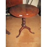 A 19th Century mahogany circular tip-up action occasional table on tripod support