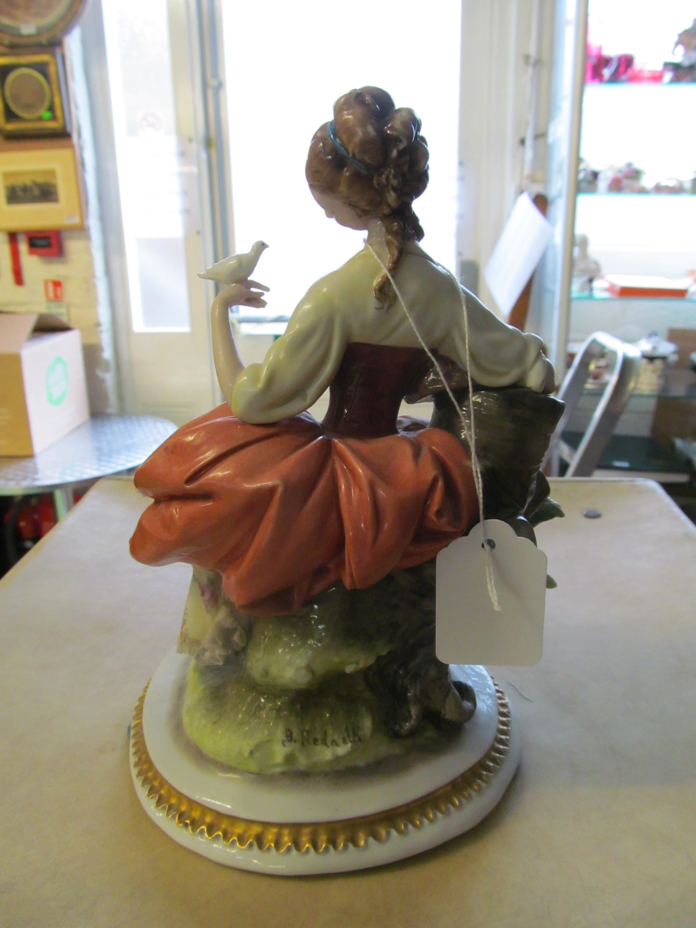 A Capodimonte figure lady with basket of flowers holding a dove - Image 21 of 22