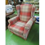 A Next armchair upholstered in tartan style material and a matching footstool