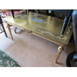 A gilt painted coffee table