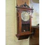 A 19th Century walnut wall clock with Tunbridge ware banding.