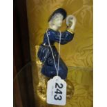 A Royal Worcester figure lady in blue dress playing a tambourine