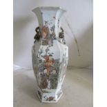 A Chinese famille verte vase of muted palette decorated figures, Chinese script and peach design