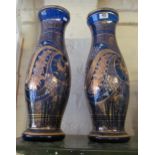 A pair of large blue and gilt glass vases