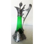 A tall WMF green glass claret jug with Art Nouveau metal mounts of ladies head and sinuous flowers