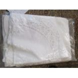 A linen table cloth and napkins