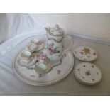 A Dresden tray, coffee pot, three cups, two saucers with hand painted floral decoration and three