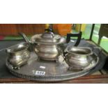A three piece plated teaset on galleried tray.