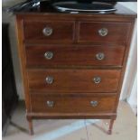 A mahogany chest of two short and three long drawers