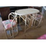 A bamboo and cane breakfast table and two chairs