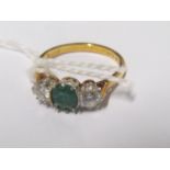 An 18ct gold emerald and diamond ring