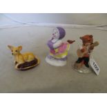 A Beswick figure Feline Flamenco, Beswick Chihuahua on cushion and a Royal Doulton Snowflake on Ice