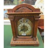 A Victorian architectural oak mantel clock with chiming Junghams movement