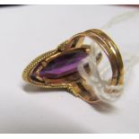A gold and amethyst dress ring