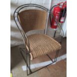 A Boulevard metal and rattan chair