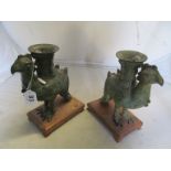 A pair of antiquarian bronze exotic bird vases on wooden bases