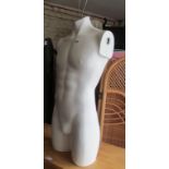 A modern white mannequin male torso