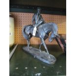 A resin bronze effect horse and jockey