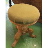 A swivel topped piano stool