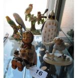 A Hummel figure girl with birds and other ornaments