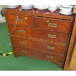 A reproduction mahogany military style chest of short and three long drawers with brass handles