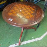 An inlaid chess board top table on pillar and tripod base