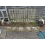 A gilt garden bench