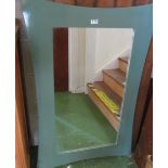 A shaped green framed modern mirror