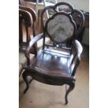 An oriental elbow chair with marble back