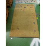 A rug with deer and camel motifs and a cream ground rug with bird and animal motifs and star