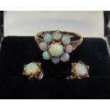 A pair of opal earrings and a diamond and opal cluster ring